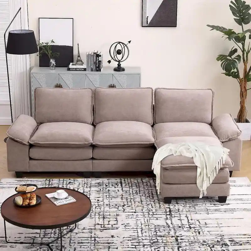 Divano componibile a L beige con pouf, 3 posti
